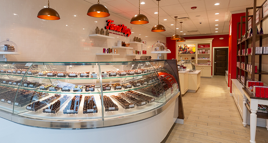 Trinidads comes to fruition. Customers enjoy the rich dark truffle centers enrobed in white confection and toasted coconut. The name comes from the island nation that is a source for legendary cocoa and coconut.